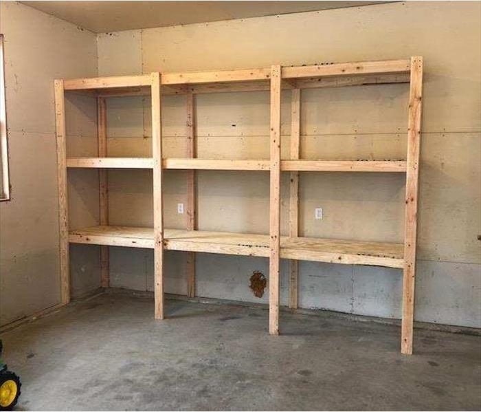 New shelving built in the unused garage space.