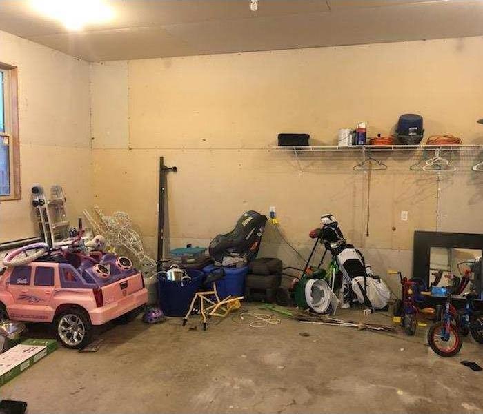 Cluttered garage with no storage.